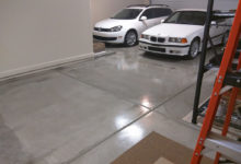 Thumbnail - garage floor epoxy coating - 2 white cars in background