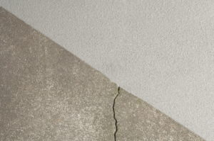 crack in the floor before using floor repair products by armorpoxy