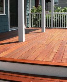 ArmorDeck for Wood Decks - red wood deck with white railing